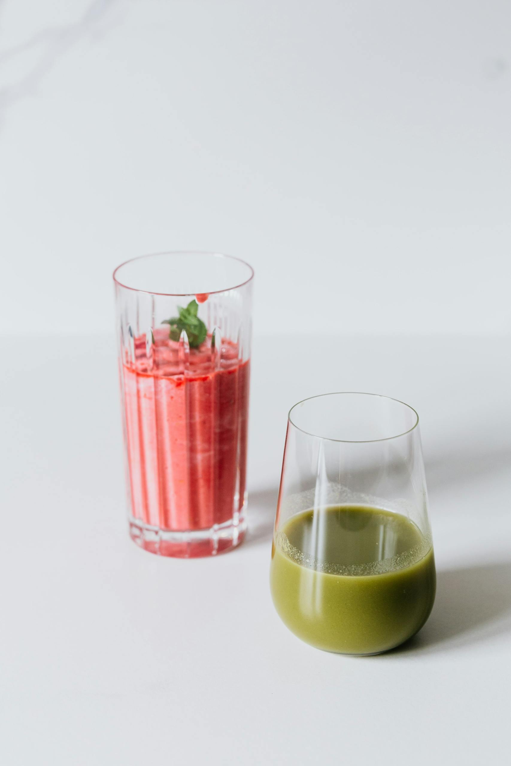 high-protein vegan snacks: A vibrant display of red and green smoothies, perfect for a healthy refreshment.