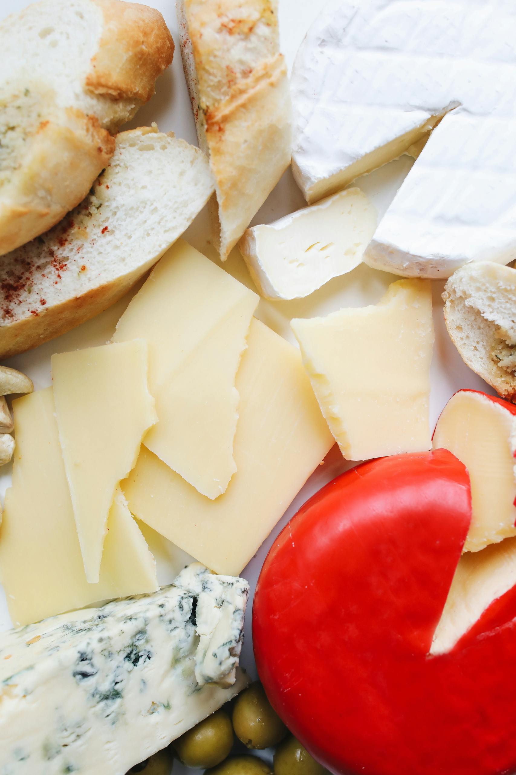zinc and hormones: Delicious assortment of cheeses and breads, perfect for a gourmet snack platter.