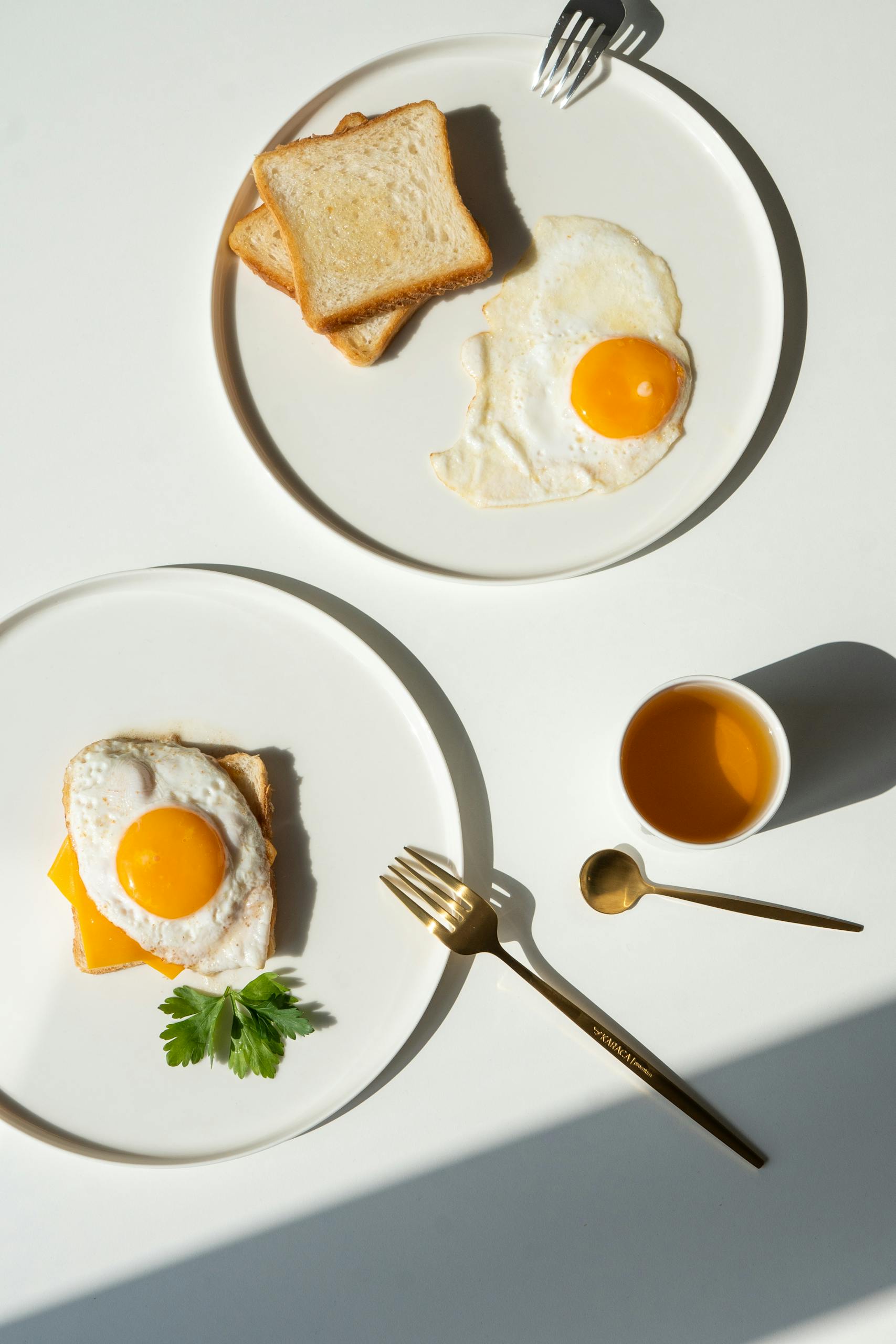 foods to eat for nausea on GLP-1: Minimalist breakfast featuring fried eggs, toast, and balanced composition for a fresh start.