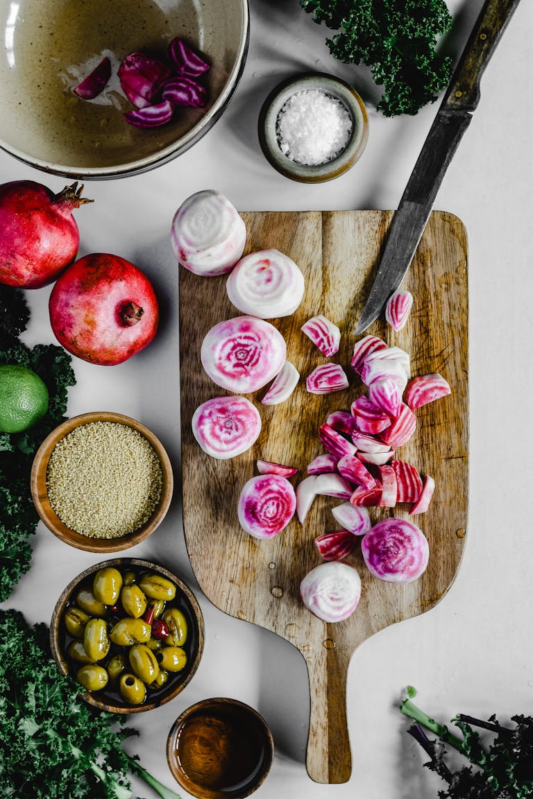 tips for vegetarians: Top view of beetroot and ingredients on a chopping board for a vibrant food preparation scene.