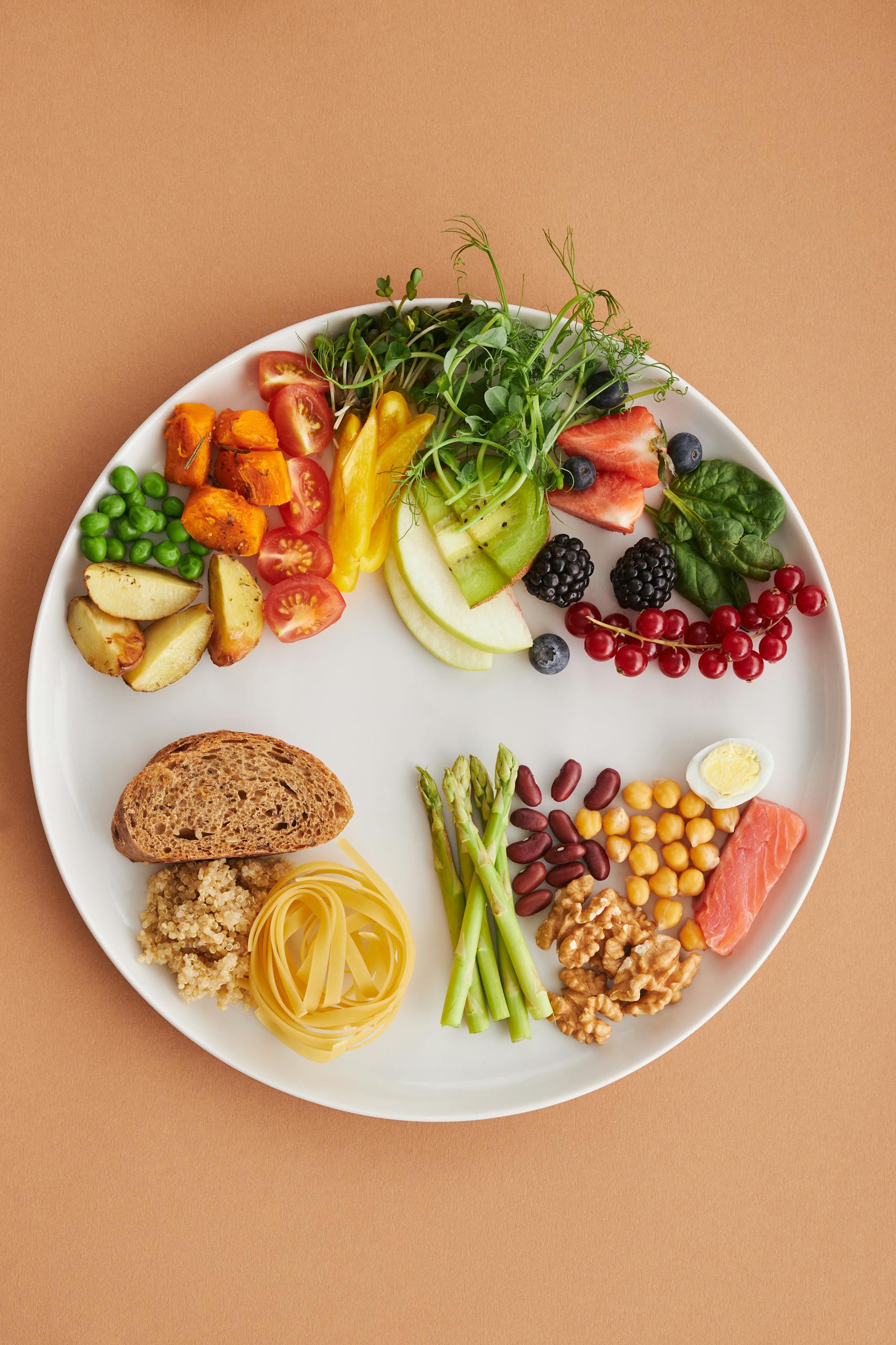 perimenopause nutrition: Colorful assortment of healthy foods on a plate, perfect for a balanced diet.
