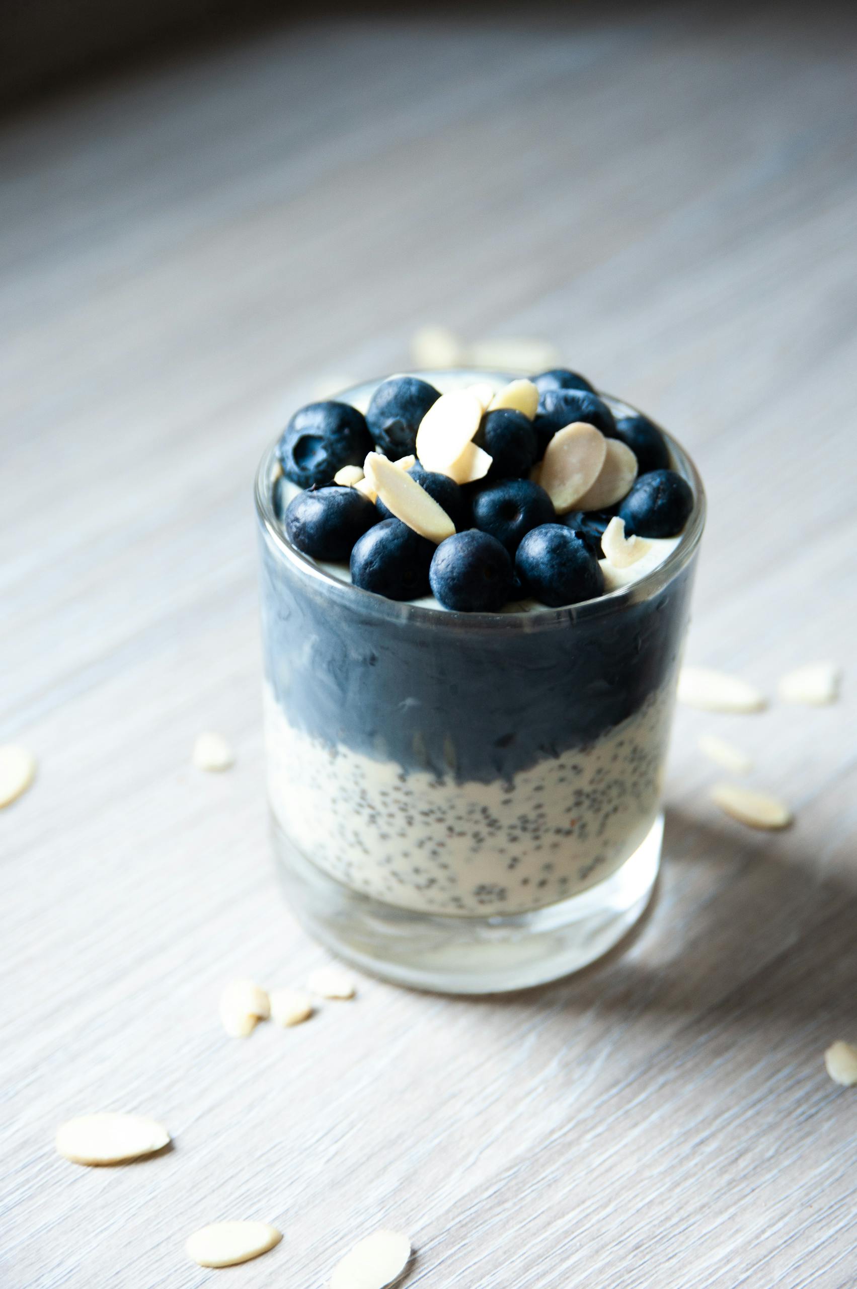 simple ways to increase calcium intake: Delicious chia pudding topped with fresh blueberries and almonds, perfect for breakfast.
