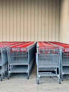 Healthiest Frozen Foods from Trader Joe's: Neatly arranged shopping carts lined up outside a retail store.