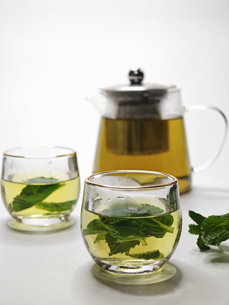 Plant-Based Foods for Joint Support: Refreshing mint tea served in elegant glassware with fresh mint leaves.