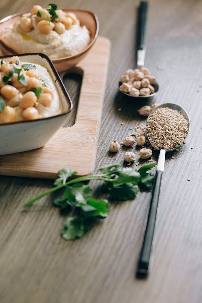 top plant-based iron foods: Close-up of a delicious hummus dish topped with chickpeas and sesame seeds.