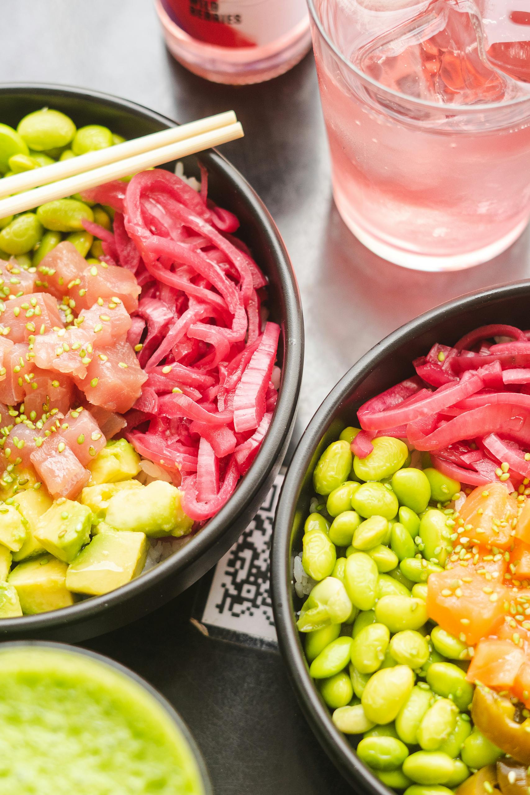 Brain-Healthy Grocery List: Vibrant poke bowls with tuna, avocado, edamame, and pickled onions.