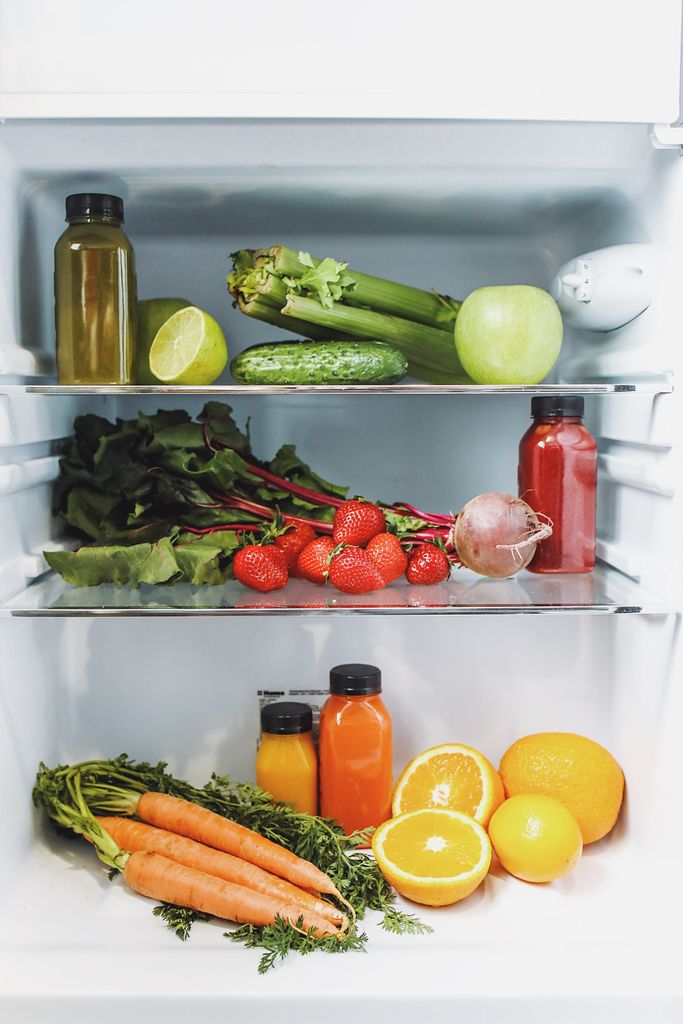 How to Reduce Food Waste at Home: Variety of fresh fruits and vegetables in a refrigerator, vibrant and healthy.