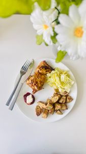 how to get enough protein on mounjaro: A delicious chicken and vegetable meal served with roasted potatoes and lettuce on a white plate.