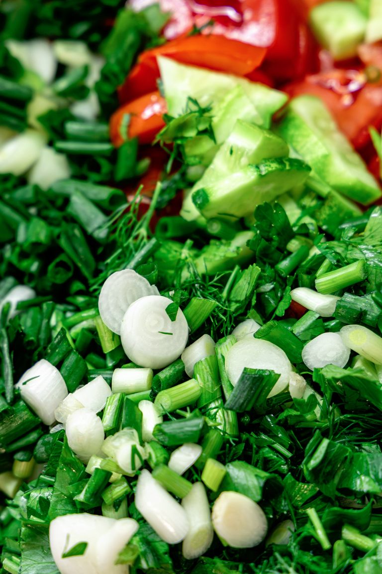 Healthy Chopt Orders: Close-up of colorful, fresh chopped vegetables ready for a delicious salad.