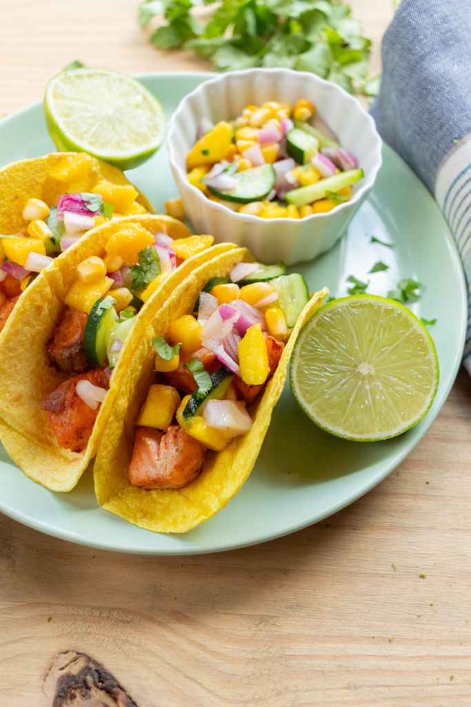 Lipedema Diet: Colorful salmon tacos topped with fresh mango salsa and lime, perfect for a summer meal.
