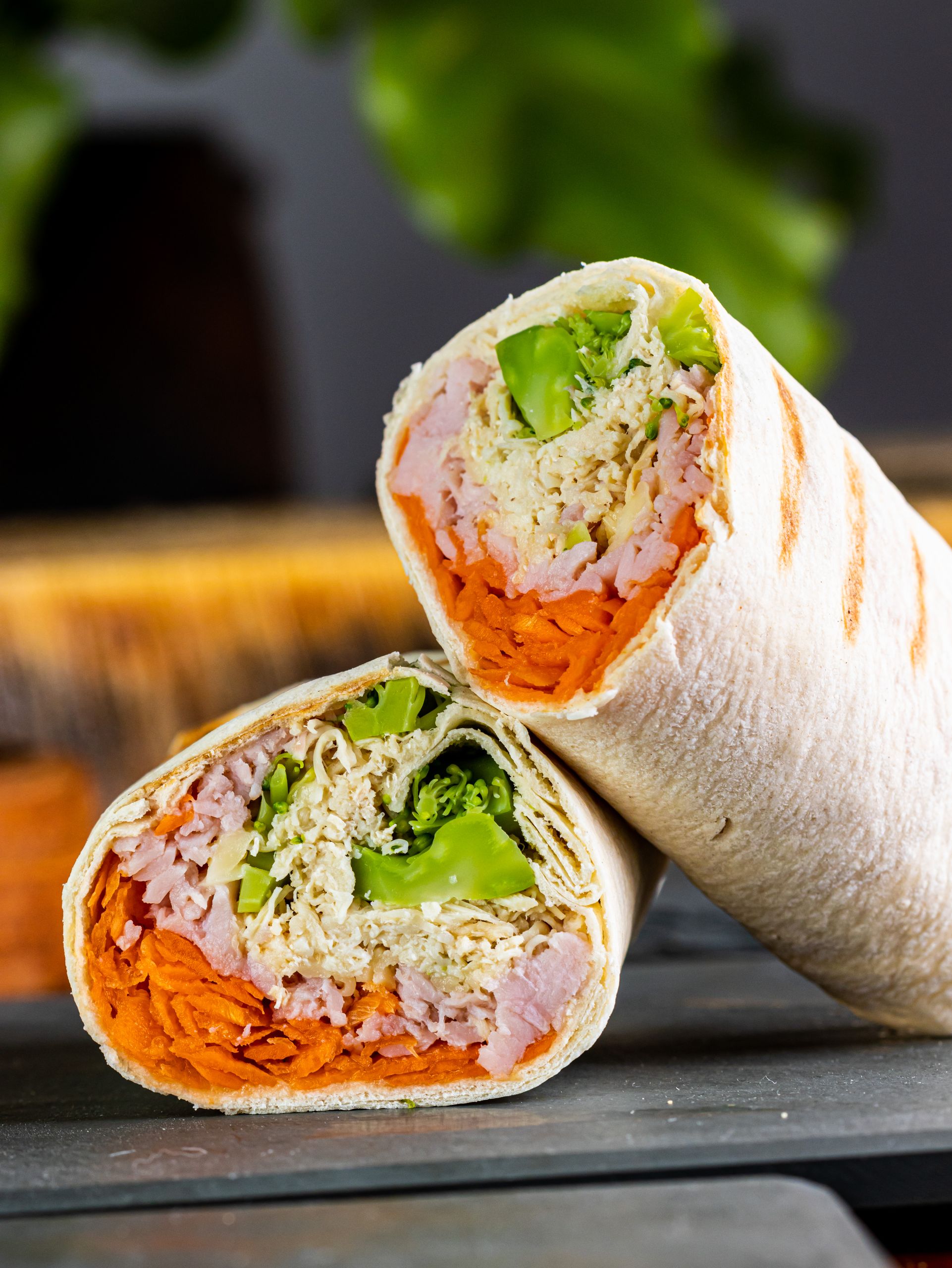 Fresh wraps filled with chicken, vegetables, and cheese, perfect for a healthy meal.