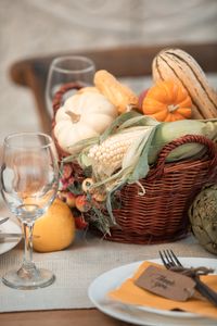 Thanksgiving Healthy Eating Tips: A traditional Thanksgiving still life with vegetables and wine glasses on a table.