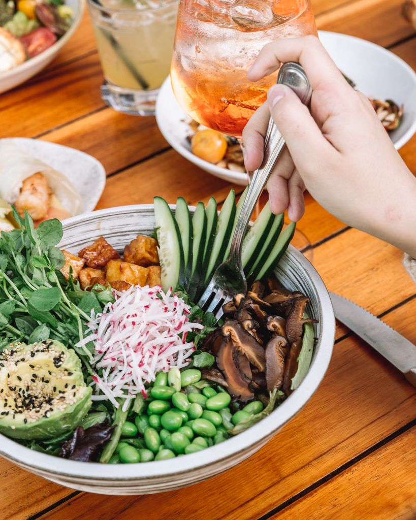 What to Order at True Food Kitchen: Colorful vegetarian salad with tofu, avocado, and more for a healthy meal.